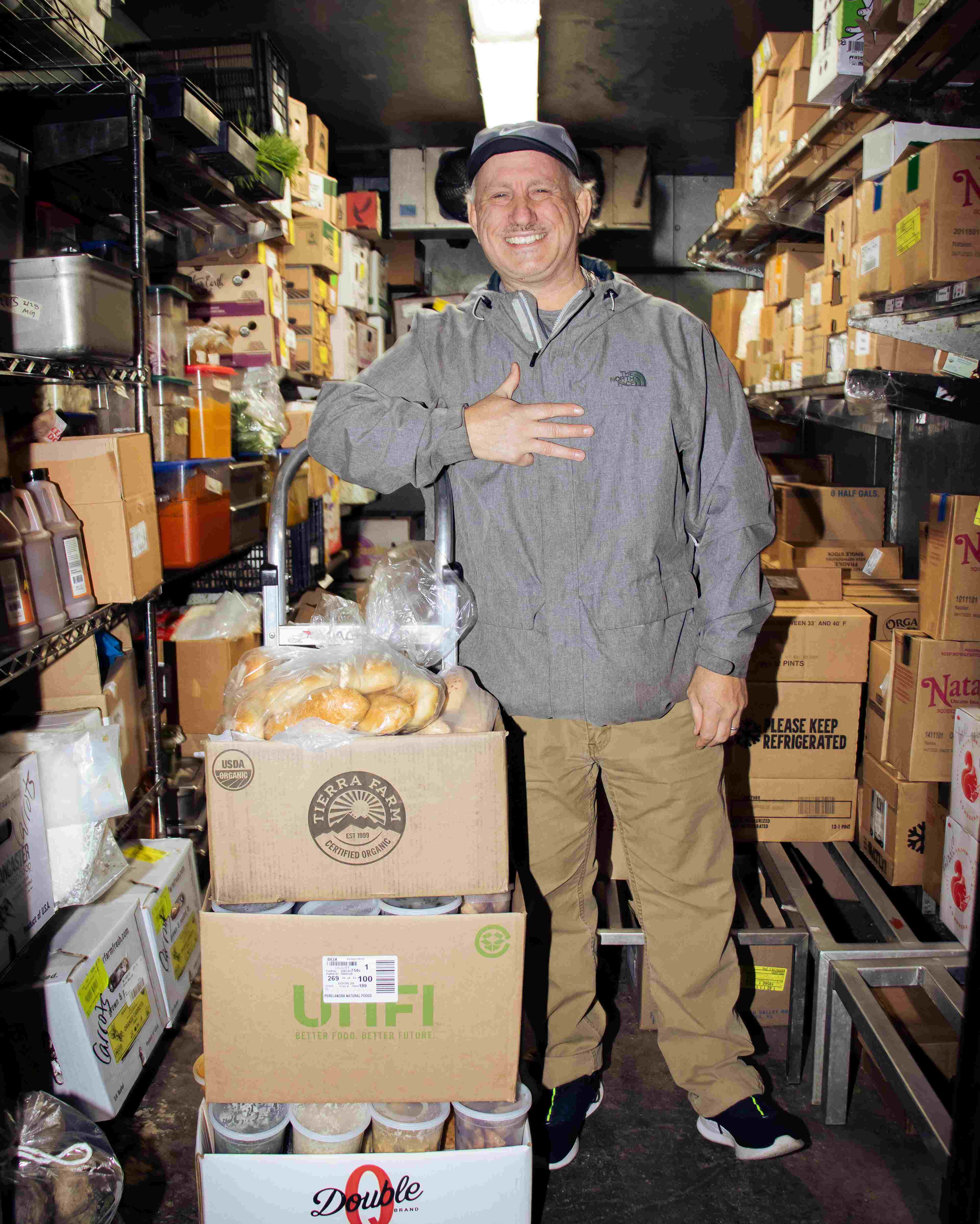Volunteer with donated food.