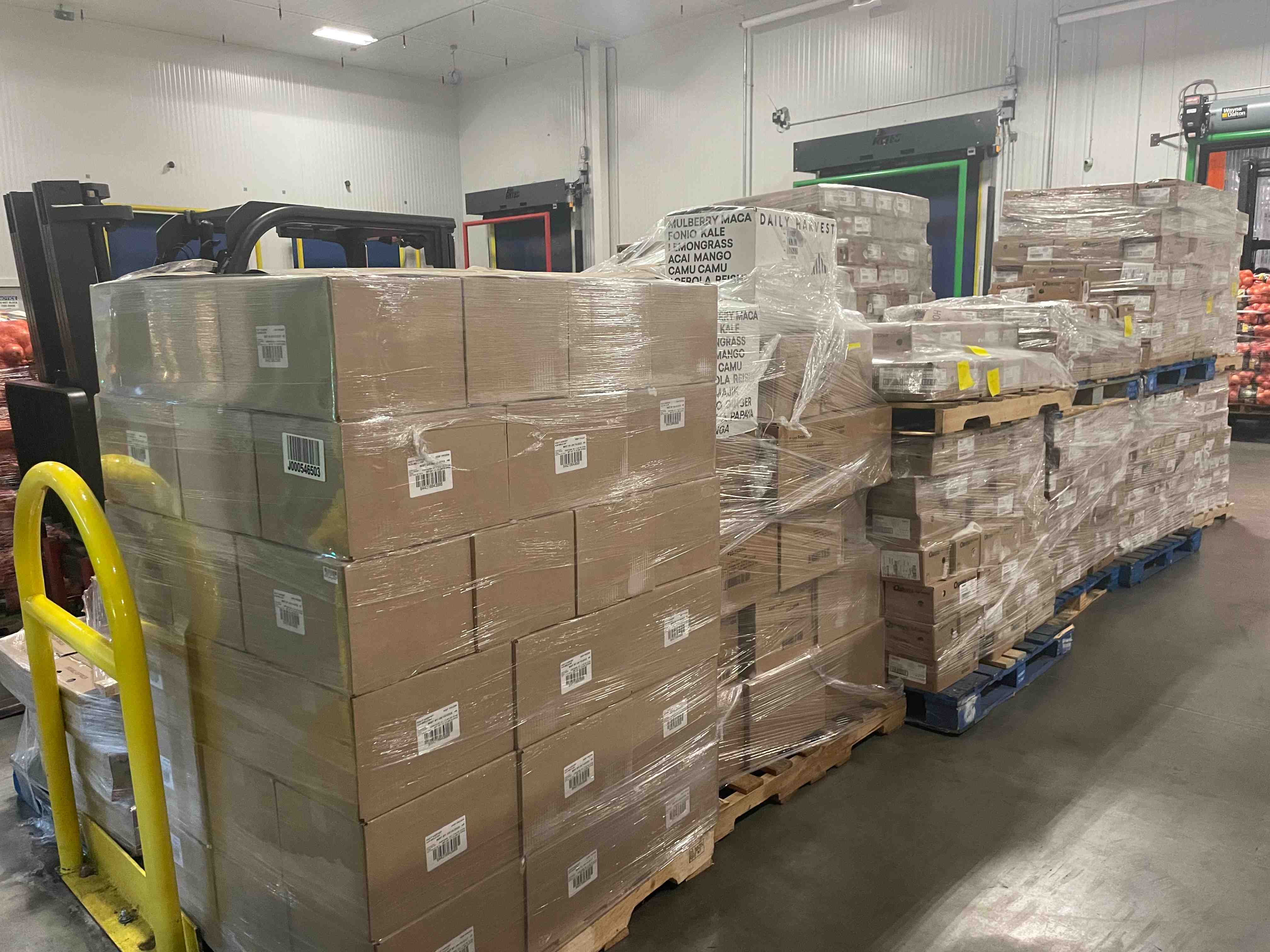 Pallets of donated food from Daily Harvest